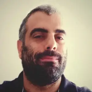 Portrait of Alessandro Brunetti, Founder and CEO of iQrypto