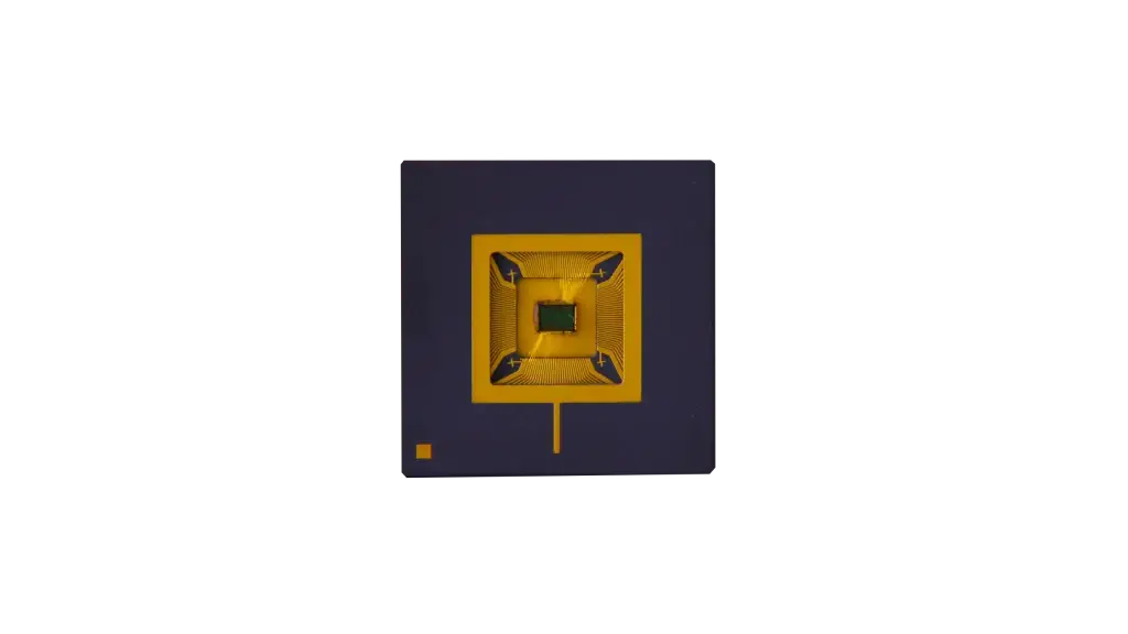 Top view of a compact QRNG microchip with symmetrical gold structure on dark substrate